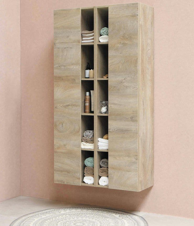 Timber shelving unit against a blush pink wall